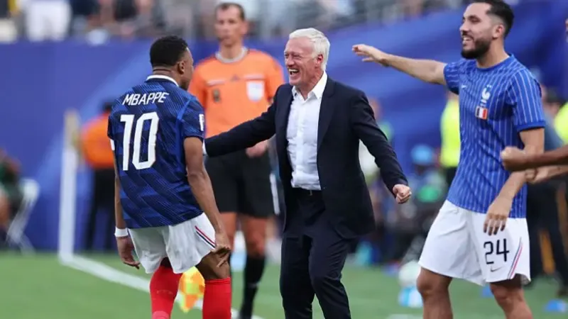 Kylian Mbappe #10 of France celebrates with Didier Deschamps, Head Coach of France, after scoring the team's first goal during the FIFA World Cup 2026 Round Of 32 match between France and Sweden.