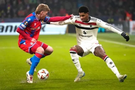 Marcus Rashford challenges Pavel Sulc during Manchester United’s Europa League win at Viktoria Plzen in December 2024