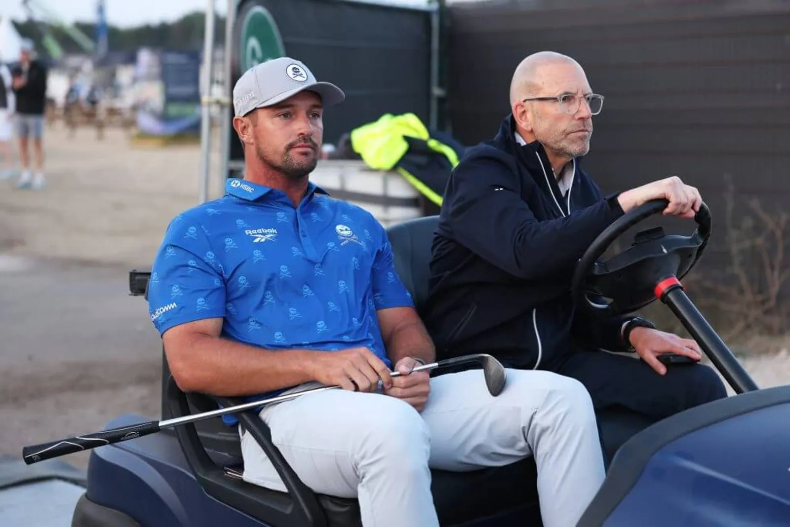 Bryson DeChambeau of the United States is driven by a rules offical on a buggy on Friday.