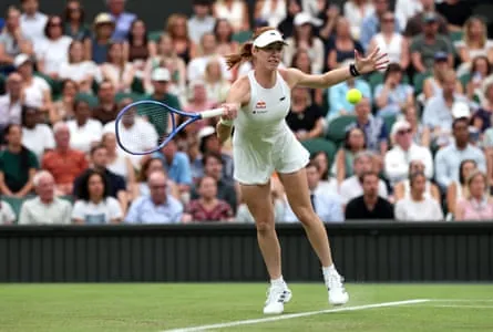 Maya Joint plays a forehand against Serena Williams during their first round match at Wimbledon.