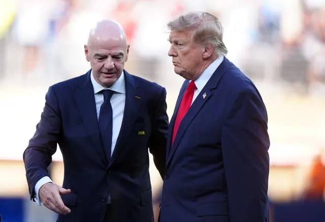 Donald Trump with Fifa president Gianni Infantino at the World Cup final (Bradley Collyer/PA).